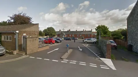 Google Boden Street car park. It is a wide entrance just off the road with public toilets to the left. 