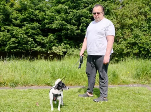 Brian Turner outside with Rocky