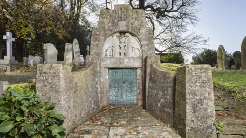 Steven Baker A mausoleum in a graveyard