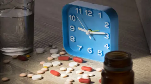 Getty Images clock and pills