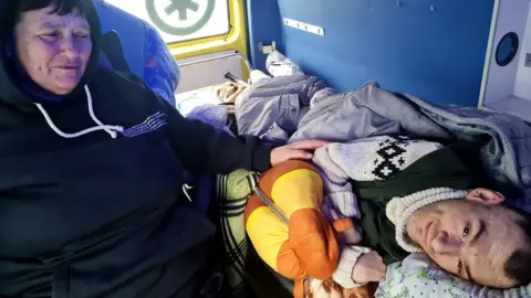 Olena Florek Olena Florek with her mother and brother in an ambulance as they travelled from Lviv to Krakow