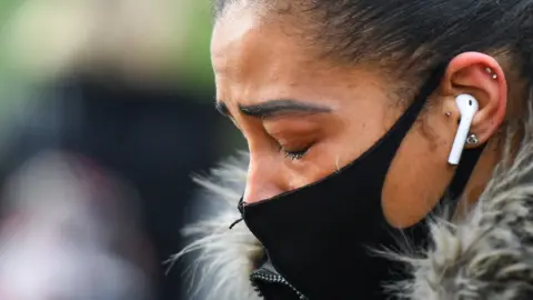 Reuters A woman cries at the memorial site