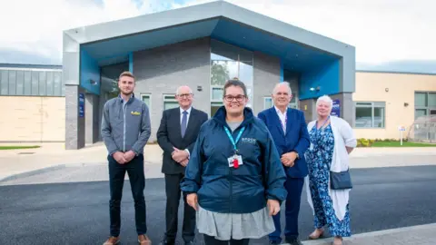 Gloucestershire County Council  L-R: George Hall, EG Carter contracts manager; Councillor Philip Robinson, cabinet member for education; Robyn-Lee Gibb, head teacher; Stephen Bradshaw, Interim CEO of the academy trust; Clare Medland, head of universal commissioning at Gloucestershire County Council