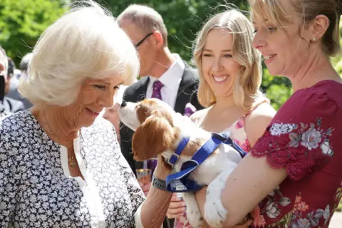 Chris Jackson / Getty Images Camilla, Duchess of Cornwall meets Mala Breeze and her dog Flora at Clarence House in London, England on 14 July 2022