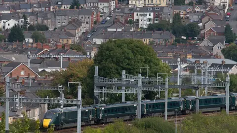 Getty Images A First Great Western train near a residential area in Newport