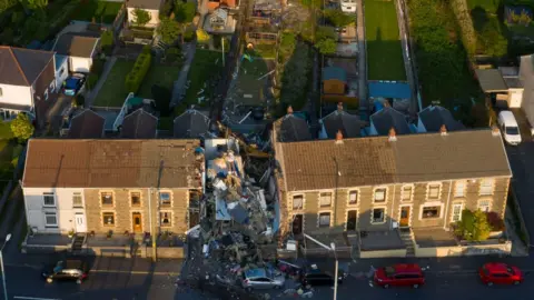 Getty Images Aerial image showing damage to house in Seven Sisters, Neath Port Talbot