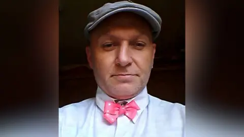 Supplied A photo of David Howard wearing a white shirt and hat. He's smiling at the camera.