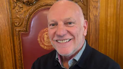 South Tyneside Council Paul Mackings, a middle-aged man with buzzed short white hair and light stubble.