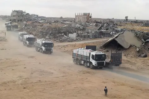 Trucks carrying aid move, amid a ceasefire between Israel and Hamas, in Rafah in the southern Gaza Strip, February 5, 2025