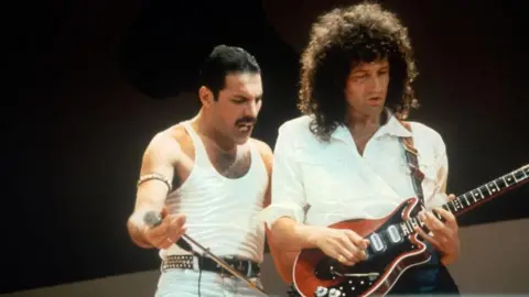 Getty Images Queen performs at the Live Aid concert in 1985 at Wembley Stadium in London.