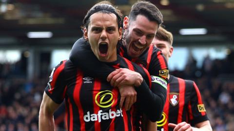 Enes Unal (front) celebrates scoring for Bournemouth against Brighton in the Premier League