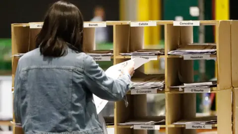 PA A person tallying votes at the Royal Dublin Society during the count for the European elections