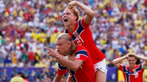 Erling Haaland of Norway celebrates his goal with teammates 