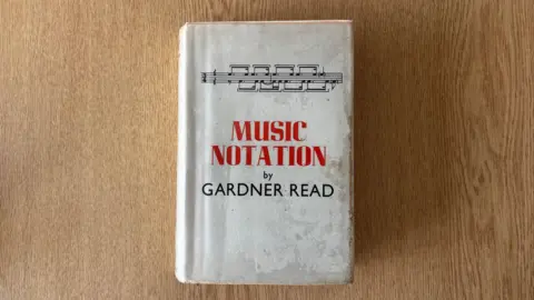 Cornwall Council A white hardback book with 'Music Notation by Gardner Read' on the cover