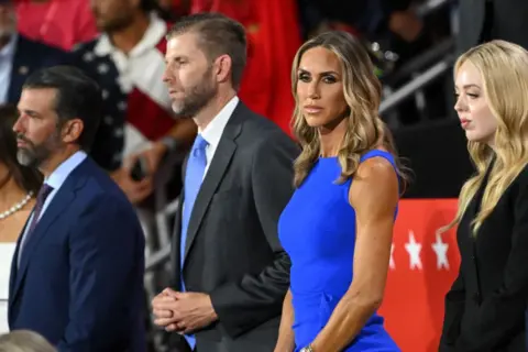 Getty Images (L-R) Donald Trump Jr., Eric Trump, co-chair of the Republican National Committee Lara Trump, and Tiffany Trump attend the first day of the 2024 Republican National Convention 