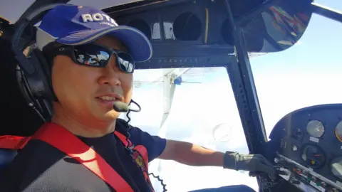 Woongsa Kim Woongsa Kim, dressed in shades, smiles for the camera while flying a small aircraft