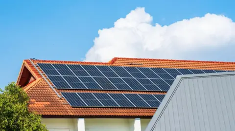 Getty Images Solar cell panels on the roof