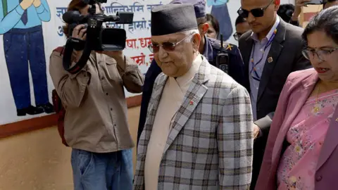 AFP via Getty Images Deposed Nepali Prime Minister and Chairman of the CPN-UML, KP Sharma Oli casts his vote from a polling booth