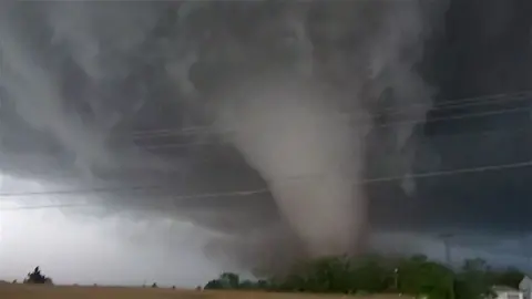 Tornado behind power lines in Enid, Oklahoma