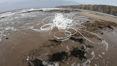 Steve Marsh Plastic piping on the beach