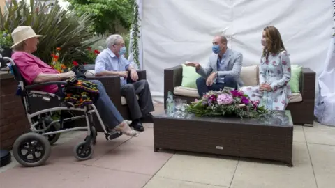 PA Media The Duke and Duchess of Cambridge speak with residents during their visit to Shire Hall Care Home in Cardiff