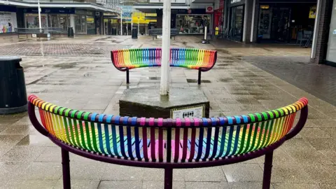 BBC Two rainbow-coloured benches in Longton, Staffordshire.