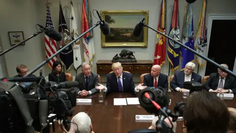 Getty Images U.S. President Donald Trump (C) speaks during a meeting with members of the House Ways and Means Committee as committee chairman Rep. Kevin Brady (R-TX) (R) and ranking member Rep. Richard Neal (D-MA) (L) listen September 26, 2017 at the Roosevelt Room of the White House in Washington, DC. President Trump met with members of the committee to discuss tax reform.