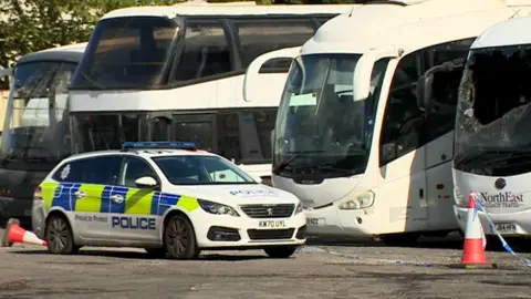 Police car near coaches