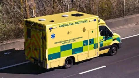 Getty Images An ambulance driving down a road