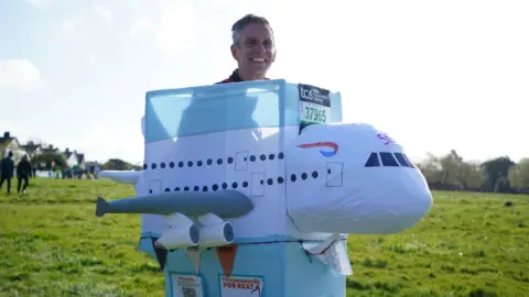 PA Media Man dressed as a plane