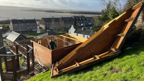 roof blown of shed