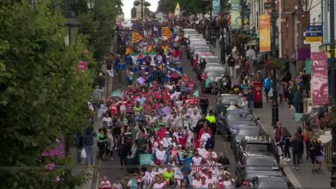 BBC The GAA World Games parade passes through Londonderry