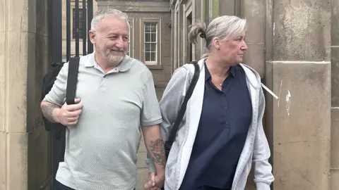 PA Media Adriana Orme arriving with her husband for the court hearing on Monday