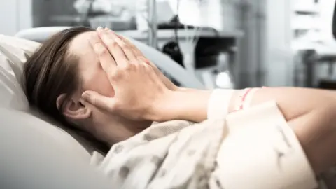 Getty Images Woman in hospital bed