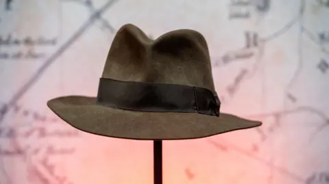 Getty Images A hat from Indiana Jones and the Temple of Doom on display during an auction in 2021.