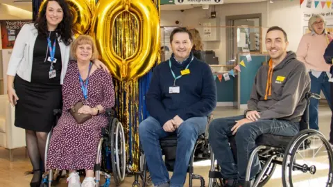 Patients and staff celebrate the centre's 80th anniversary