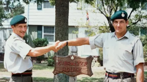 Royal Marines Joe House and Jonathan Lear pictured shaking hands at Camp Lejeune in the 1980s