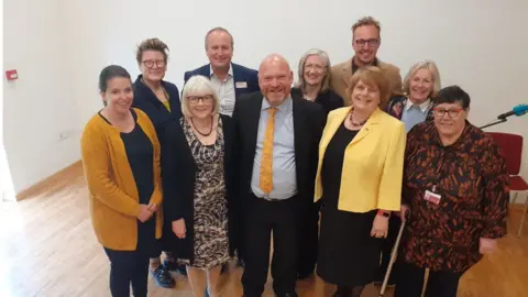 Somerset Council The new Somerset County Council Executive. From Left, Federica Smith Roberts, Sarah Dyke, Liz Leyshon, Mike Rigby, Bill Revans (Leader), Heather Shearer, Adam Dance, Ros Wyke, Tessa Munt, Val Keitc