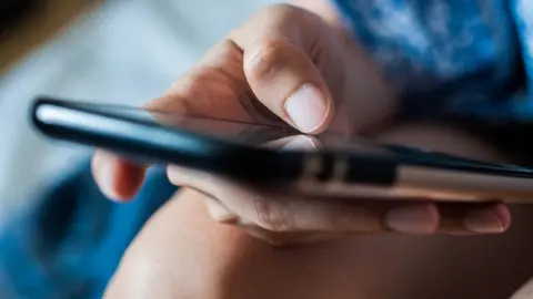A person holding a phone