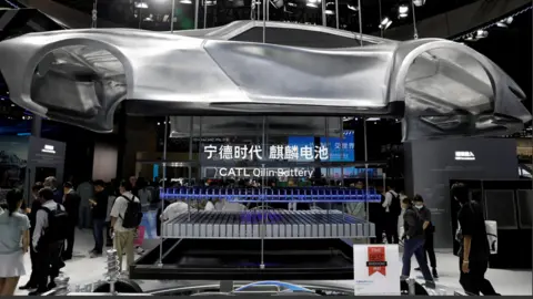 People visit the booth of battery manufacturer CATL at the Beijing International Automotive Exhibition, or Auto China 2024, in Beijing, China, 25 April, 2024.