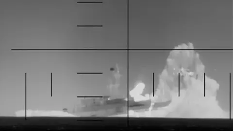 Still image of the moment a US torpedo struck an Iranian naval ship in the Indian Ocean on 04 March 2026
