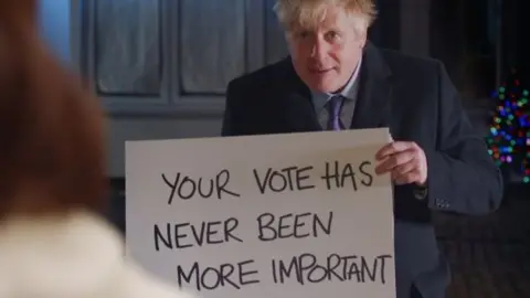 PA Media Boris Johnson in a Love Actually-themed election campaign video