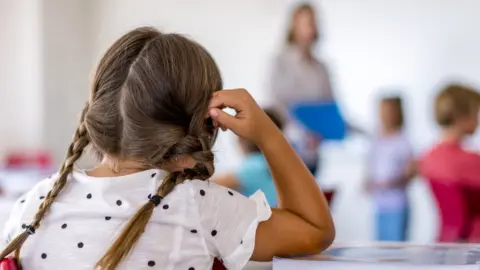 Getty Images/HRAUN Schoolgirl in classroom