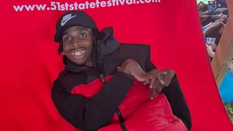 Family handout James sat on a large deck chair after the attack