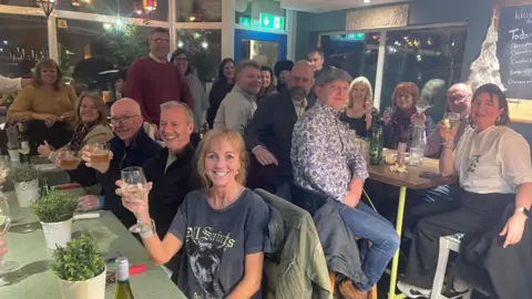 Jackie Smith Customer sitting at a table