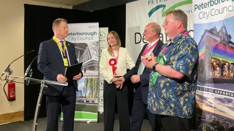 Shariqua Ahmed/BBC Daisy Blakemore-Creedon learning she won on stage