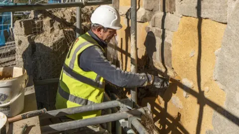 Stella Fitzgerald A workman working on the castle