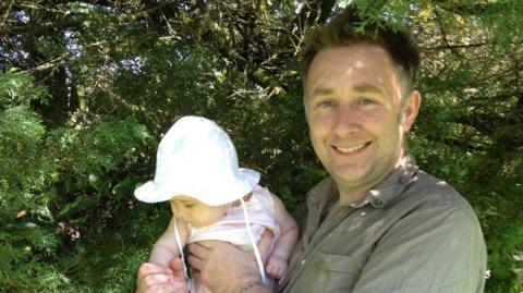 John Morrissy with baby daughter