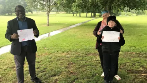 Ade Adeyemo Harvey Eustace, aged 10, mum Steph Freeman and councillor Ade Adeyemo in Olton Jubilee Park