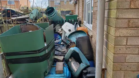 Stroud District Council  Rubbish in garden